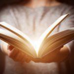 Light coming from book in womans hands 002